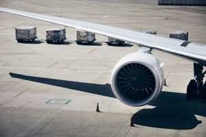 Loading of cargo containers to plane at airport